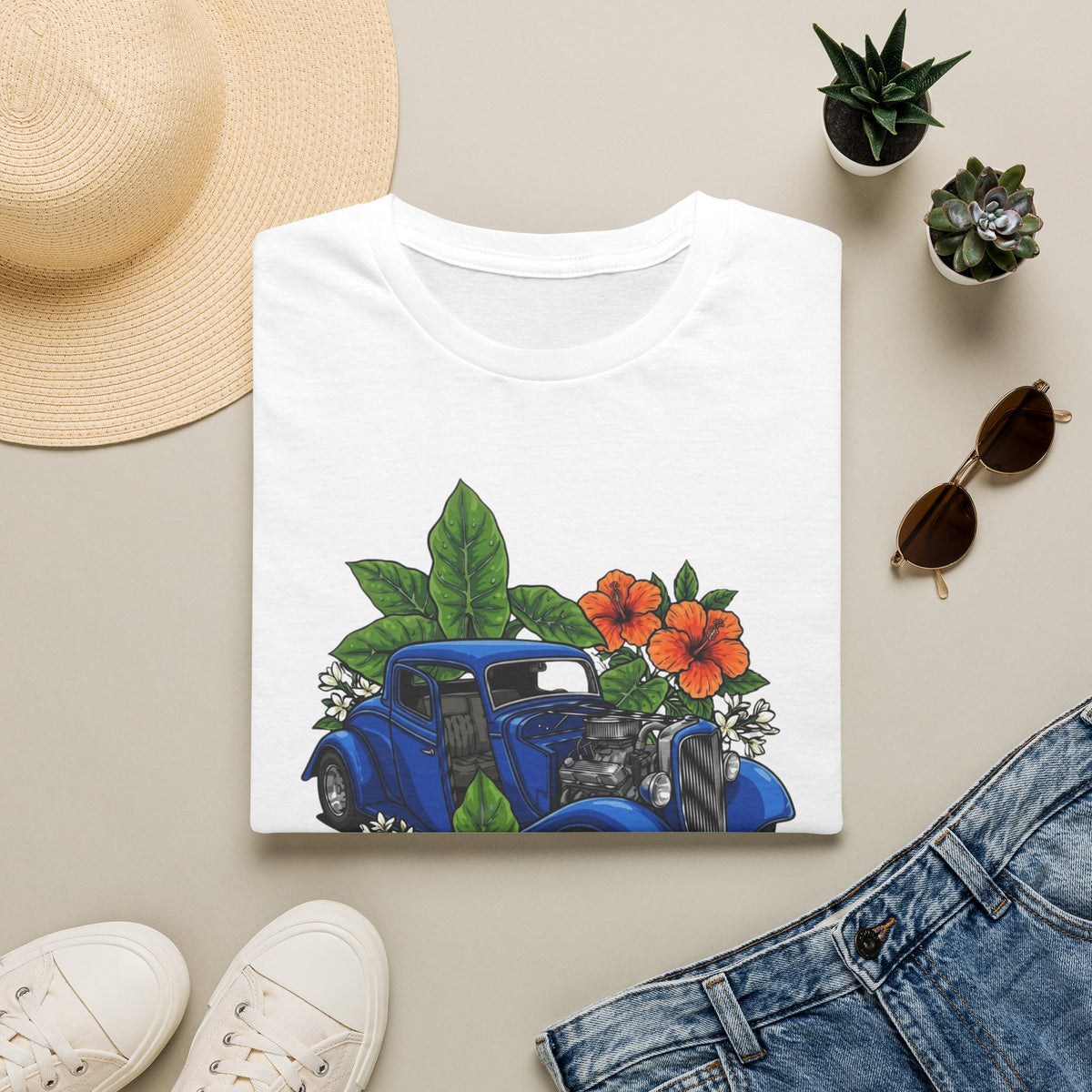 Botanical custom car culture with blue vintage car with elephant ears, orange hibiscus and white jasmine.